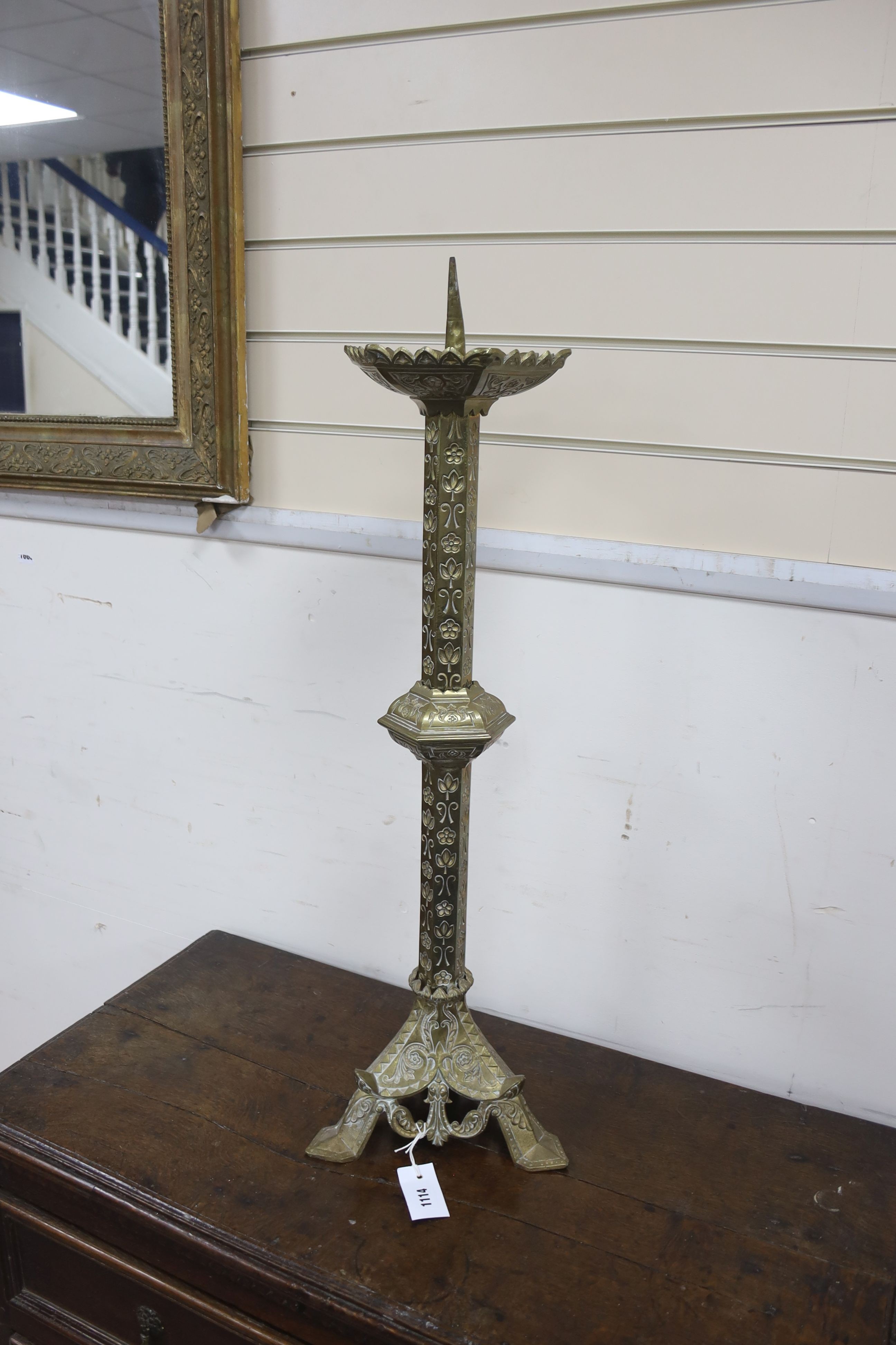 A brass eclisiastical candlestick, height 82cm
